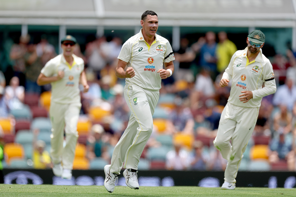 Scott Boland celebrates after taking a wicket.